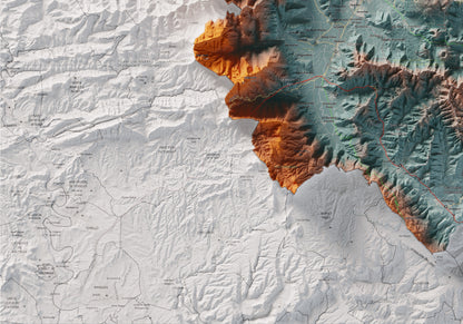 Mapa de relleu de la Garrotxa, amb el territori en color i l’entorn en blanc. Detall de la part inferior esquerra. 70 × 100 cm. Estil Blau i taronja.