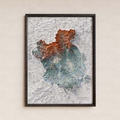 Mapa de relieve del Vallès Occidental, con el territorio en color y el entorno en blanco. Presentación con marco. 30 × 40 cm. Estilo Azul y naranja.